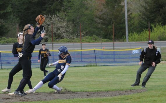Forks’ Karee Neel steals second base against Ilwaco who Forks defeated 11 to 0 and 15 to 2 in this double header played at the Fred Orr Memorial Park in Beaver. Photo by Lonnie Archibald