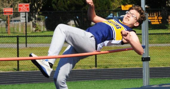 Trent Prose in the high jump.