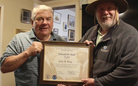 Jerry King on the left receives his latest award, the Stoll Award, recognizing his over fifty years of weather data keeping. John Burg from NOAA on the right presented the framed certificate. Photo Christi Baron