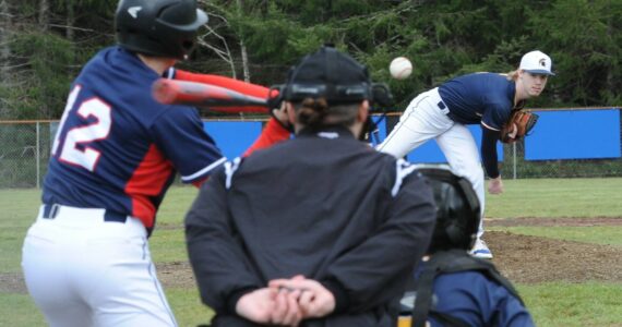 Spartan pitcher Gunner Rogers was selected as the 2B Pacific League MVP. Pictured here, It was a swing and a miss by the Pe Ell/Willapa Valley batter as Rogers threw another strike in this league game won by Forks. Rogers also batted 370 for the season. Photo by Lonnie Archibald