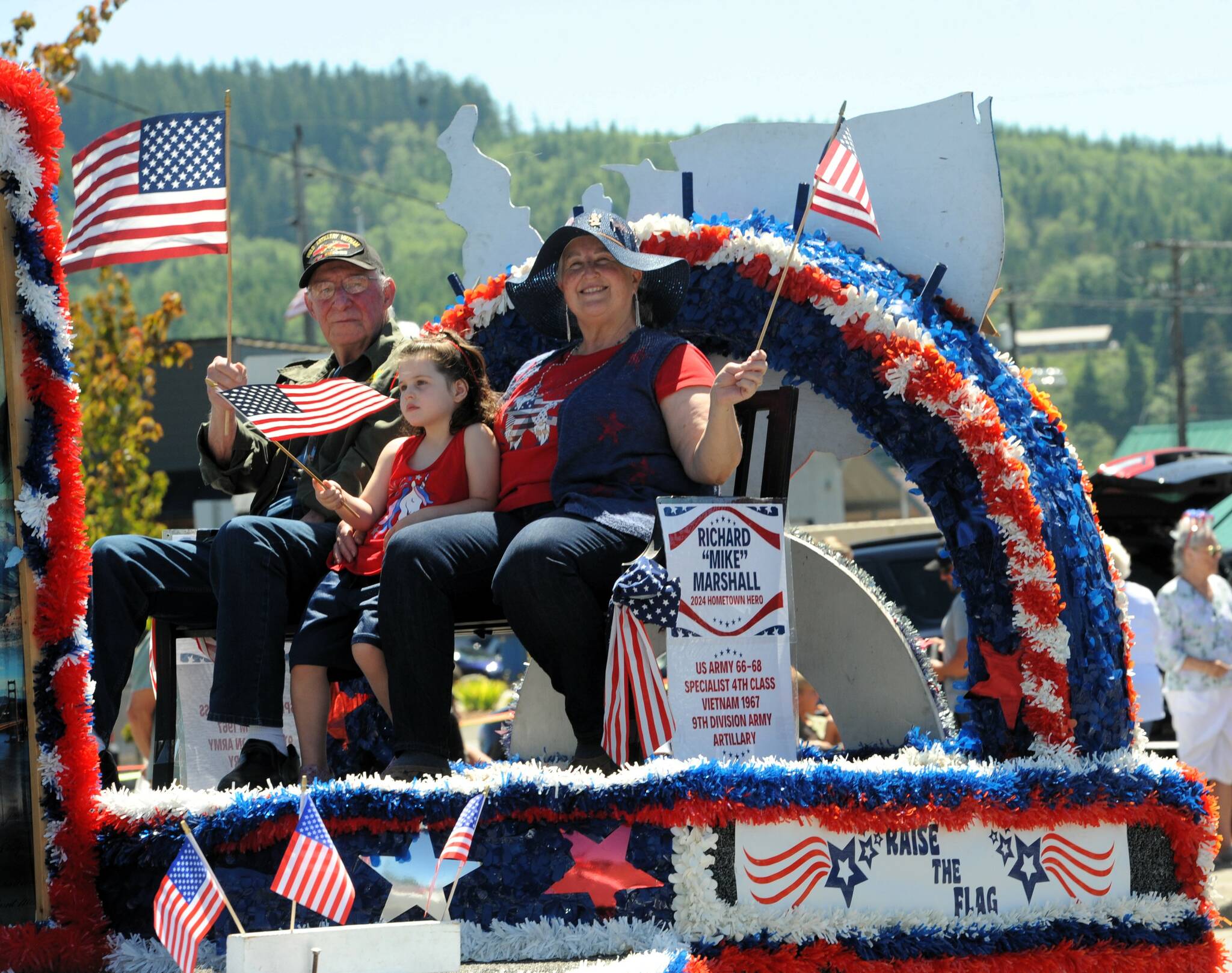 Vietnam veteran Richard “Mike” Marshall was this year’s Hometown Hero, riding on the Forks 4th float. Joining him was his wife Michele and granddaughter Penelope.