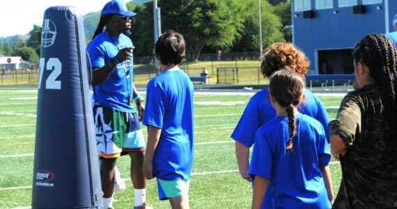 Former Seattle Seahawks special teams captain and current coach Neiko Thorpe instructs athletes.