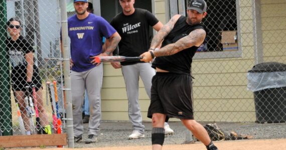 Dustin Gaydesk hits for Hit For Brains during the championship game. Photo Lonnie Archibald