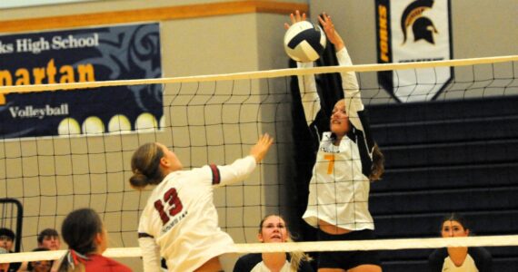 It was the story of the comeback kids on Sept. 24 in the Spartan gym as Forks who kept falling behind came back to defeat Hoquiam 3 to 2 in this non-conference contest. Pictured, here Forks’ Karee Neel goes for the block against Hoquiams’s Piper Stankavich. Looking on are teammates Bailey Johnson and Erika Williams. Photo by Lonnie Archibald