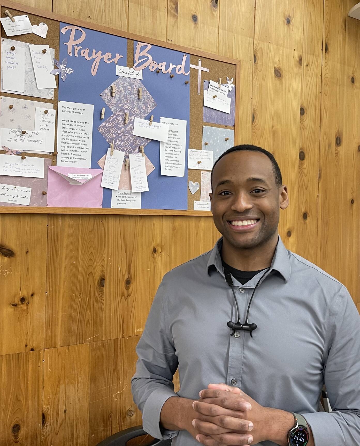 Tilus stands in front of the newly added Prayer Board at the pharmacy, where anyone can share a prayer request. “We start our day with prayer—who doesn’t need a little prayer sometimes?” he said.