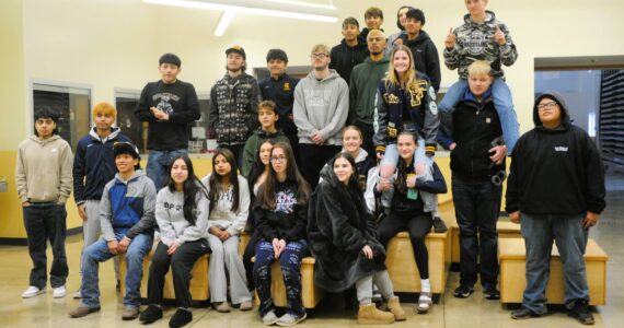 Forks wrestlers pose for photos before departing to Tacoma last Thursday for the 2B state championships. Photo by Lonnie Archibald