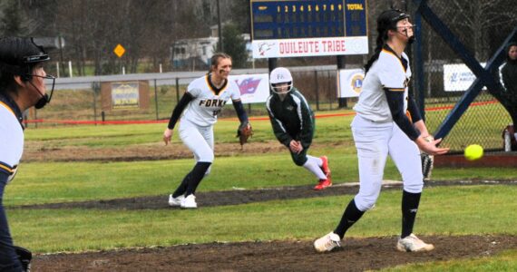 Spartan pitcher Chloe Gaydeski delivers the pitch while first baseman Avery Dilley prepares for any possible play. Forks defeated the Port Angeles JVs 12 to 5 and 18 to 11 in this doubleheader played at the Fred Orr Memorial field in Beaver.