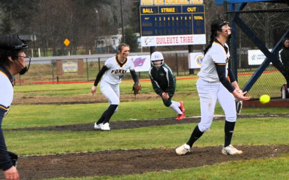 Spartan pitcher Chloe Gaydeski delivers the pitch while first baseman Avery Dilley prepares for any possible play. Forks defeated the Port Angeles JVs 12 to 5 and 18 to 11 in this doubleheader played at the Fred Orr Memorial field in Beaver.