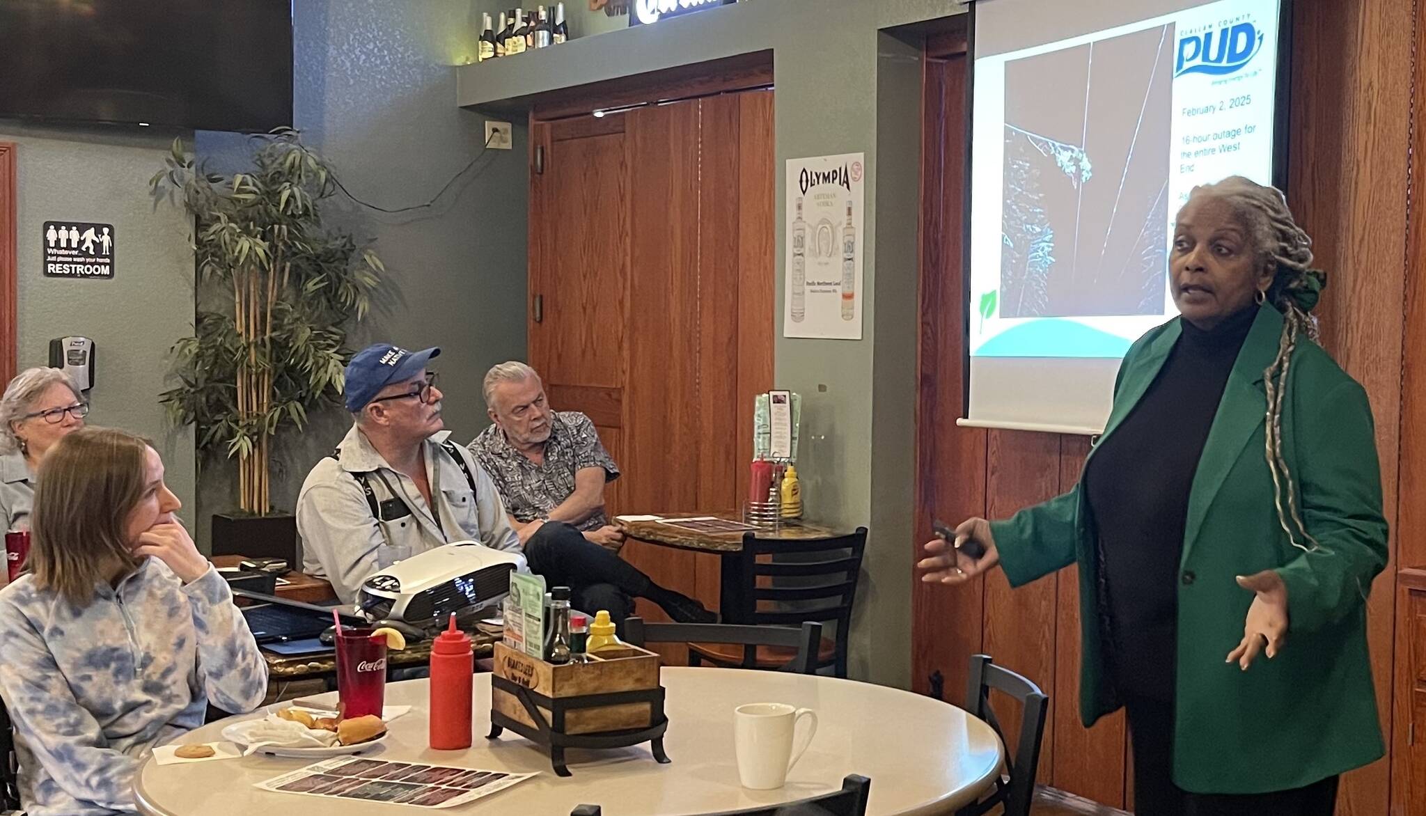 Photo Christi Baron
PUD Commissioner Phyllis Bernard shares a slide showing the cause of the recent 16 hour power outage.