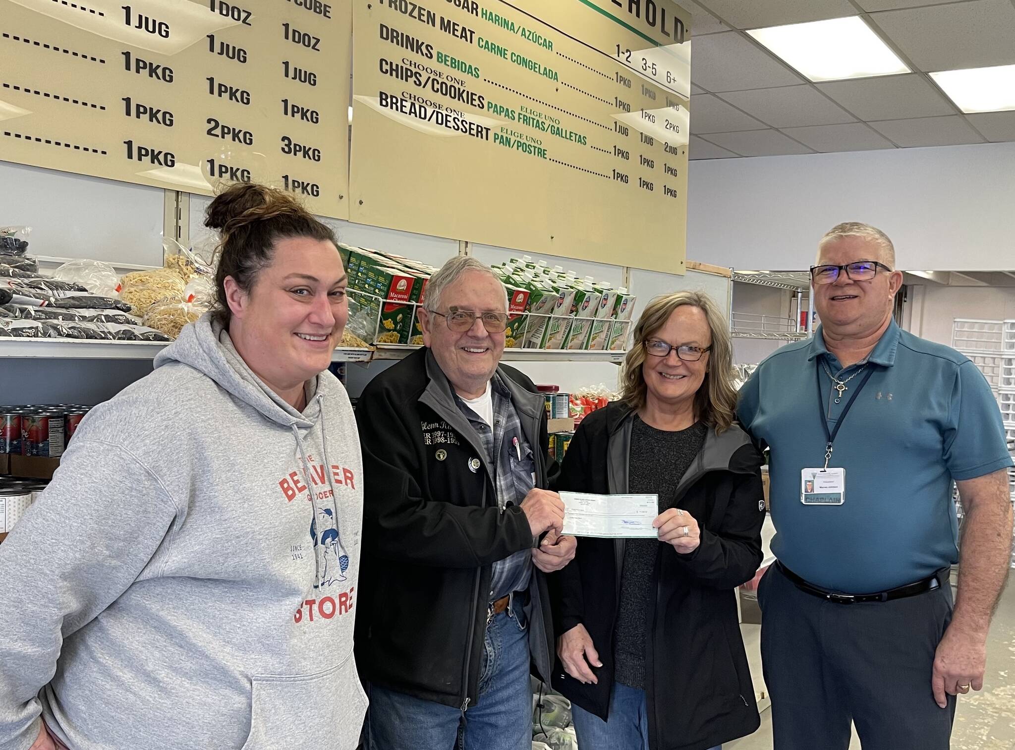 Photo Christi Baron
The Forks Elks recently donated $1,500 to the Forks Food Bank from a grant they received. In addition, they recently presented a $600 donation on behalf of Monica Henry, who contributed her compensation from performing at the Elks’ 50th Anniversary party.
In the center of the photo, Glenn King of the Forks Elks presents the check to Pat Soderlind, Executive Director of the Forks Food Bank. Also pictured are Sena Engeseth, Food Bank Operations Manager (left), and Warren Johnson, Forks Food Bank Board President (right).
The Food Bank, 181 Bogachiel Way, will hold an Open House on April 3, from noon-6 p.m., Forks Chamber will offer an official Ribbon Cutting at 2 p.m. Enjoy light refreshments, explore the space, and see firsthand how the Food Bank supports the community.