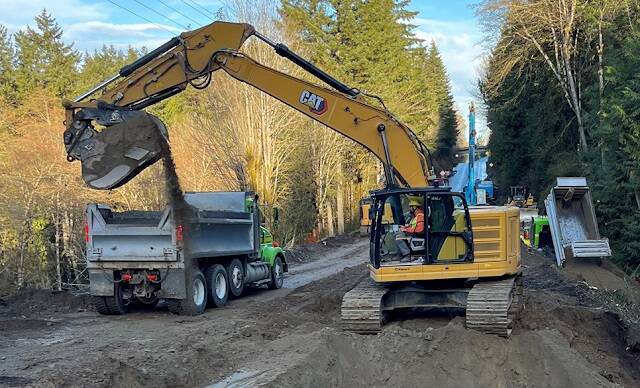 US 101 is closed at Tumwater Creek while crews dig up the roadway to replace an outdated culvert. WSDOT photo