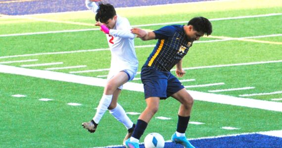 Photos by Lonnie Archibald
Forks’ Dominick Aranda Santiago (right) challenges Hoquiam’s Alexander Perez for ball control at Spartan Stadium, where Forks defeated the Grizzlies 5 to 1.
