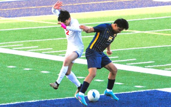 Photos by Lonnie Archibald
Forks’ Dominick Aranda Santiago (right) challenges Hoquiam’s Alexander Perez for ball control at Spartan Stadium, where Forks defeated the Grizzlies 5 to 1.