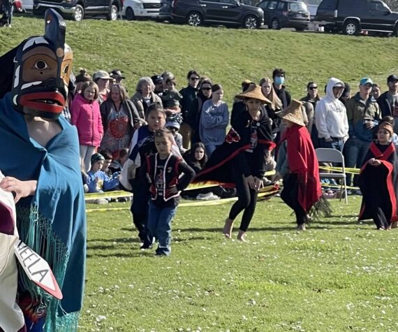 <p>Photos Christi Baron</p>
                                <p>Students from the Quileute Tribal School perform the 18th annual Welcoming the Whale ceremony at First Beach in La Push on Friday. Under sunny skies and before a large crowd, the event honored the gray whales spring migration with traditional songs, dances, and offerings — a tradition begun by the Quileute Tribe in 2007. While no whales appeared during the ceremony, their passage through Quileute waters is part of their annual journey between Mexico and the Arctic.</p>