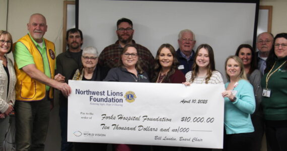 Last week members of the Northwest Lions Foundation and local Lions gathered to award the Forks Hospital Foundation a check for $10,000 to benefit the ongoing fundraising efforts for a new mammography unit.
Seen in the photo are Forks Community Hospital CEO Heidi Anderson, Mike Dukes Lions Foundation Trustee, District 19–L, from the Clallam Bay Sekiu Lions Club, Forks Lions Club members Javier Contreras and Elliot Mann, Gary Reidel Lions Foundation Secretary/Treasurer, from the Port Angeles Lions Club, District 19–L, Bill Lundin Foundation Chairman of the Board, from the Hazel Dell Lions Club, District 19–N, Vancouver, WA.
Linda Lundin, FCH Foundation members Kim Hull, Shilo Salsgiver, Jenna Gates, Halie Fletcher, Laci Johnson and Tabetha Gaydeski.
Photo Christi Baron