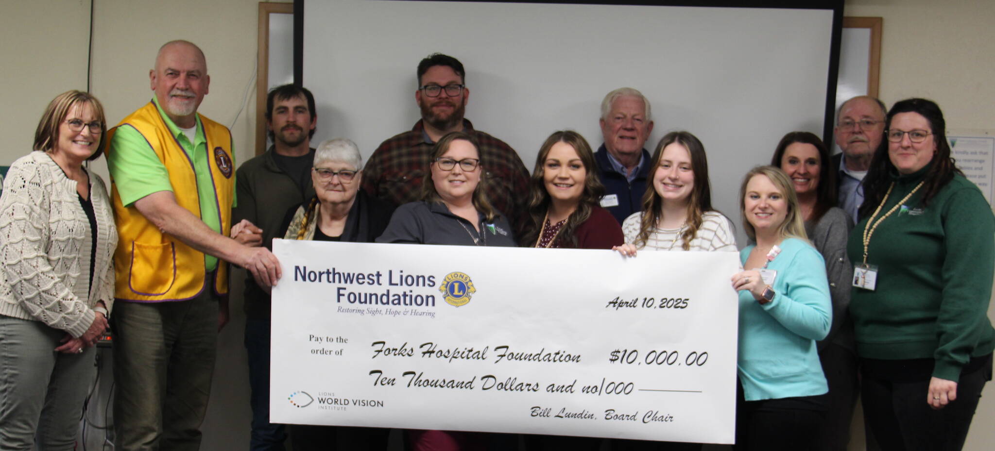 Last week members of the Northwest Lions Foundation and local Lions gathered to award the Forks Hospital Foundation a check for $10,000 to benefit the ongoing fundraising efforts for a new mammography unit.
Seen in the photo are Forks Community Hospital CEO Heidi Anderson, Mike Dukes Lions Foundation Trustee, District 19–L, from the Clallam Bay Sekiu Lions Club, Forks Lions Club members Javier Contreras and Elliot Mann, Gary Reidel Lions Foundation Secretary/Treasurer, from the Port Angeles Lions Club, District 19–L, Bill Lundin Foundation Chairman of the Board, from the Hazel Dell Lions Club, District 19–N, Vancouver, WA.
Linda Lundin, FCH Foundation members Kim Hull, Shilo Salsgiver, Jenna Gates, Halie Fletcher, Laci Johnson and Tabetha Gaydeski.
Photo Christi Baron