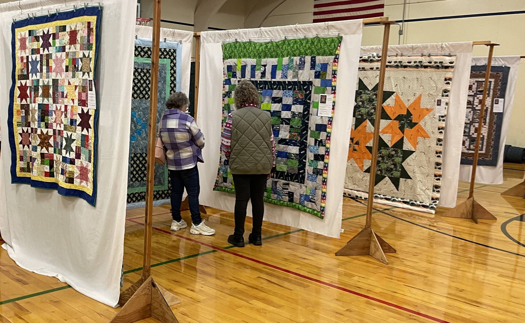 Angie McReynolds and Lisa McReynolds stopped to get a closer look as they checked out the amazing work done by quilters from around the area.