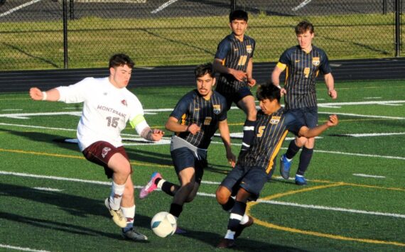 Photos by Lonnie Archibald
Spartans DeAnthony Davila (8), Orlando Camacho (5), Abraham Montealegre (10), and Brody Owen (9) on the defense against the Bulldogs, whom Forks defeated on the turf of Spartan Stadium on April 15.