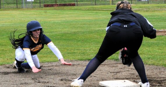 Photo By Lonnie Archibald
Spartan Kinley Rondeau slides safely into third base against Ilwaco who Forks defeated 8 to 1 and 17 to 1 in this doubleheader held at the Fred Orr Memorial Park April 29.