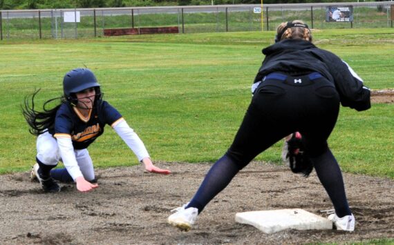 Photo By Lonnie Archibald
Spartan Kinley Rondeau slides safely into third base against Ilwaco who Forks defeated 8 to 1 and 17 to 1 in this doubleheader held at the Fred Orr Memorial Park April 29.