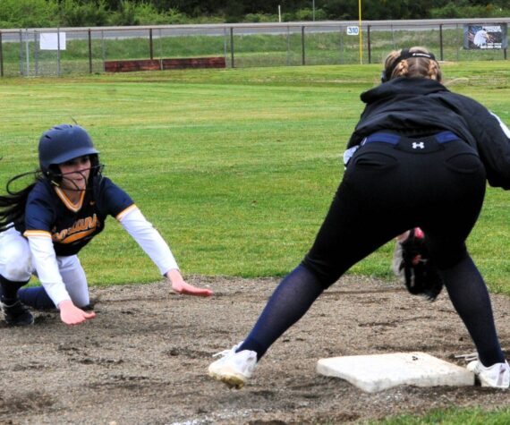 Photo By Lonnie Archibald
Spartan Kinley Rondeau slides safely into third base against Ilwaco who Forks defeated 8 to 1 and 17 to 1 in this doubleheader held at the Fred Orr Memorial Park April 29.