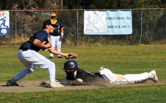 Photo by Lonnie Archibald
The Sequim runner steals second as Spartan second baseman Mason Dent makes the tag. 2A Sequim defeated the Spartans 15 to 9 in this non-league contest.