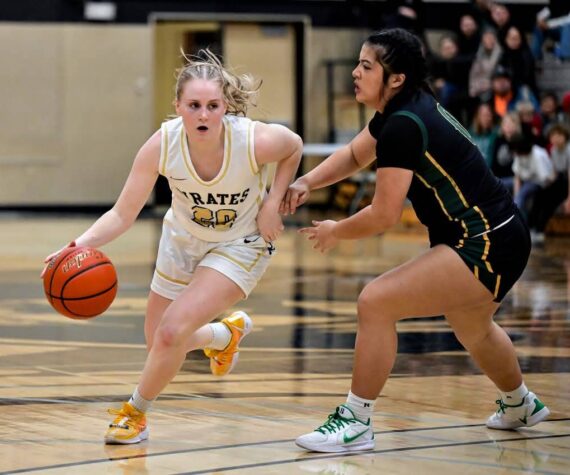 <p>Peninsula Pirates Athletic Department</p>
                                <p>Pirate guard Kadie Wood handling the ball in a game against Shoreline. Wood scored 10 points.</p>