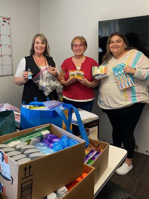 Pictured here with supplies for Mariposa House are: Tawnya Rowley, SIORF member Sharla Fraker, and Maria Davila. 
Submitted photos