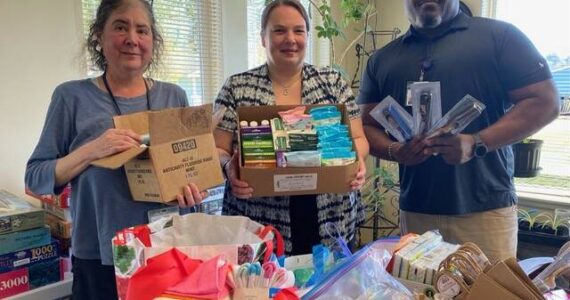 Soroptimist International of the Olympic Rain Forest recently delivered hygiene supplies to the Hope Center and Mariposa House. Pictured here with boxes of supplies are the Hope Center case managers: Jessica Mishler, Christine Lee and Kevin Moody.