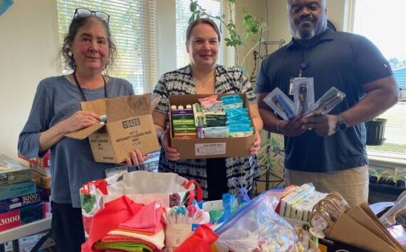 Soroptimist International of the Olympic Rain Forest recently delivered hygiene supplies to the Hope Center and Mariposa House. Pictured here with boxes of supplies are the Hope Center case managers: Jessica Mishler, Christine Lee and Kevin Moody.