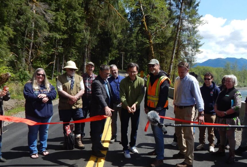 <p>And the ribbon is cut, Thursday, May 8, by Governor Bob Ferguson, offcially re-opening the Upper Hoh Road and access to the Hoh Rain Forest. Photo Christi Baron</p>