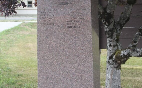 Photo Christi Baron
The monument at Forks City Hall honors the memory of fourteen West End servicemen who gave their lives in service to our country. Their names—Walter Fletcher, Arthur Wittenborn, George Welch, Lorrell Cassell, Frank Daman Jr., S. George Vogel Jr., Robert Price, Earl Brandeberry, Arthur Munson Jr., Norman Lodholm, Vernon Depew, Douglas Foster, Donald Kraft, and Jason Hanson—are etched in remembrance. Dedicated by VFW Post #9106.