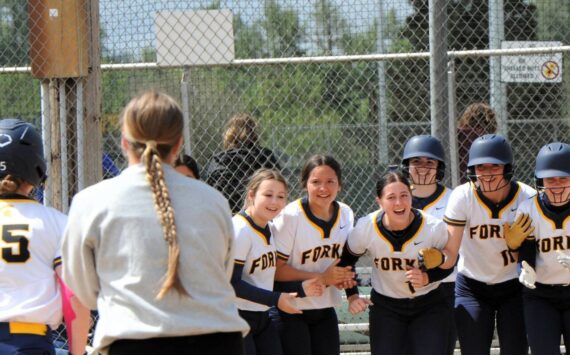 Photos by Lonnie Archibald
Spartan teammates await at home plate as Forks 8th grader Brooklynn Rondeau rounds the bases with a home run against Napavine. Brooklynn also hit a two-run homer against Rainier in the second game during this 2B District 4 playoffs held in Centralia.