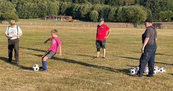 The Forks Elks recently hosted their annual Soccer Shoot. Chuck Jennings, Mike Leavitt, and Don Leavitt look on as a contestant takes a turn. Forty-four participants took part. Photo Teri Leavitt