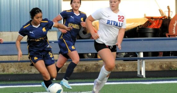 Photo by Lonnie Archibald
Spartan Kim Camacho controls the ball against East Jefferson (a combination of Port Townsend and Chimacum players) Monday, Sept. 29, at Spartan Stadium, where Forks defeated the Rivals 7 to 0. Also in the action is Forks’ Jade Blair.