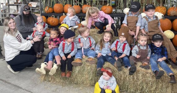 Photo Christi Baron
The setup for the Little Logger photo always takes longer than the contest! A few of the tiniest lumberjacks needed parental backup — one or two looked ready for a nap instead of a log roll and a few were more interested in the hay.