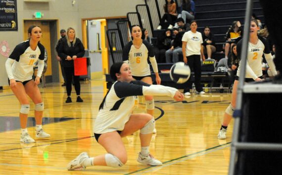 In volleyball action against Chief Leschi, Spartan Fynley Peters hits. Also in the action are Spartans Avery Dilley (11), Chloe Gaydeski (6), and Bailey Johnson (2). Forks defeated the Warriors 3 to 0. Photo by Lonnie Archibald.