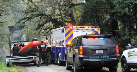 Photos by Lonnie Archibald
First responders work to launch the CCFD#1 swiftwater rescue raft at the Goodman Mainline bridge.