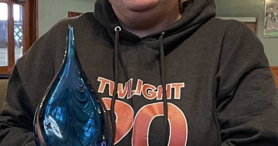 Forks Chamber of Commerce Executive Director Lissy Andros recently traveled to Bellevue to attend the Washington Festivals and Events Association 2025 Awards, where she was honored as the Small Market Event Organizer of the Year for the Forever Twilight in Forks Festival. She is seen here with her award. Photo Christi Baron