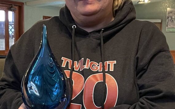 Forks Chamber of Commerce Executive Director Lissy Andros recently traveled to Bellevue to attend the Washington Festivals and Events Association 2025 Awards, where she was honored as the Small Market Event Organizer of the Year for the Forever Twilight in Forks Festival. She is seen here with her award. Photo Christi Baron