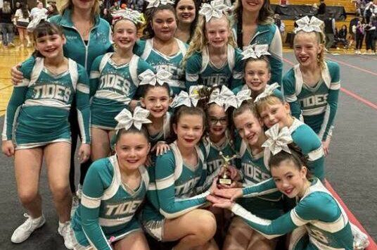 Submitted photo
Coastal Cheer started their season strong with a big first-place finish at the Bison Bonanza! The 13-girl squad is coached by Head Coach Melanie Stonebreaker, along with Assistant Coaches Capriele Celaya and Charlotte Burns. This is the first of six competitions for the team, with their next stop in two weeks at the Carnival Classic.