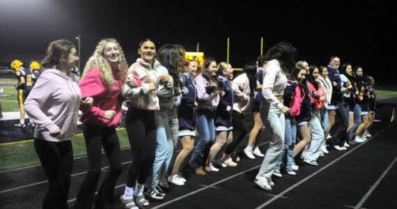 Photos by Lonnie Archibald
With a little help from their friends, the Forks student body rooters came out of the stands to cheer with the Spartan cheerleaders during the Forks vs Napavine game played at Spartan Stadium on Oct 30.