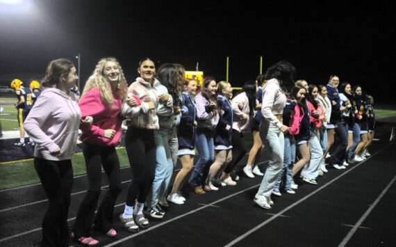 Photos by Lonnie Archibald
With a little help from their friends, the Forks student body rooters came out of the stands to cheer with the Spartan cheerleaders during the Forks vs Napavine game played at Spartan Stadium on Oct 30.