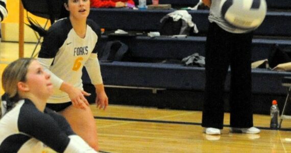Photos Lonnie Archibald
Coach Jenn LeDuke looks on while Bailey Johnson and Chloe Gayeski make a play.
