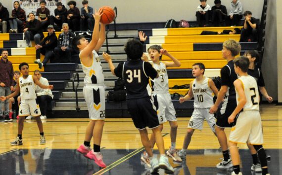 Spartan Kaden Woody rebounds against Stevens. Also in the action are Cam Campbell (4), Declan Weekes (3), Nolan Wilson (10), and Jaxon Koskela (2).
Photo by
Lonnie Archibald