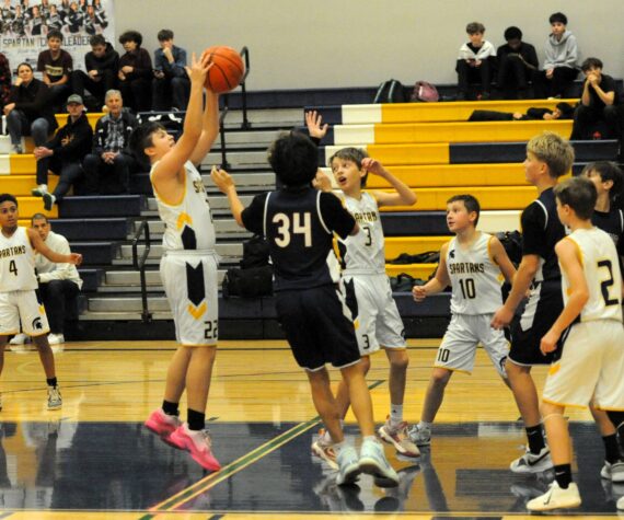 Spartan Kaden Woody rebounds against Stevens. Also in the action are Cam Campbell (4), Declan Weekes (3), Nolan Wilson (10), and Jaxon Koskela (2).
Photo by
Lonnie Archibald
