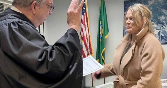 Clallam County District Court II Judge Bruce Hanify swore in the newest member of the Forks City Council on Monday, Dec. 1, during a special council meeting. Corey Pearson won election in November over Armistead Coleman, who had been appointed to fill a vacancy. Submitted photo