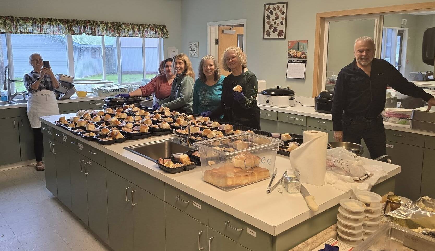 Submitted photo
Feeding 5000 volunteers served turkey and all the trimmings during their most recent Free lunch last Tuesday at the Community Center. Here you see 45 ready-to-eat meals packed up for those in need. Many thanks to the dedicated volunteers who make this effort possible every week, and Merry Christmas from Eugene, Don, Sherry, Debbie, Pat, Cathy, Chrissy, Theresa, Saydee, and Charles.