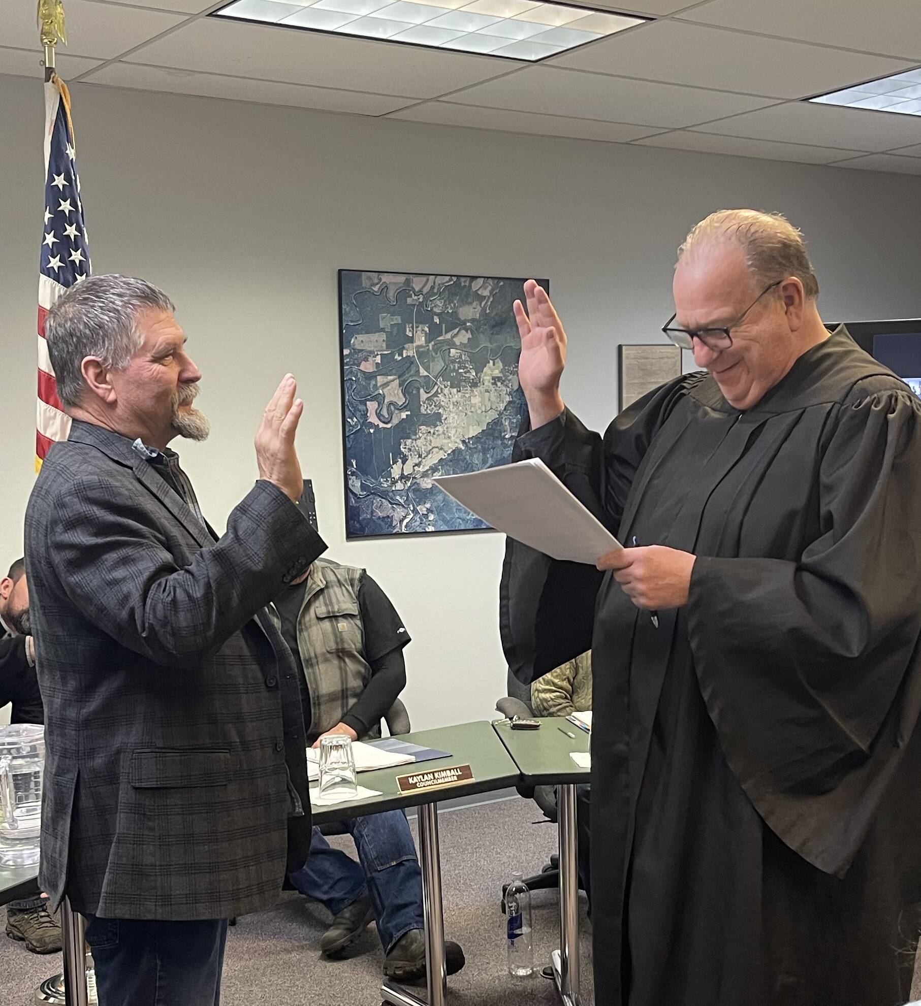 Mayor Tim Fletcher takes his oath of office from Judge Hanify as he will serve another term as Forks Mayor.