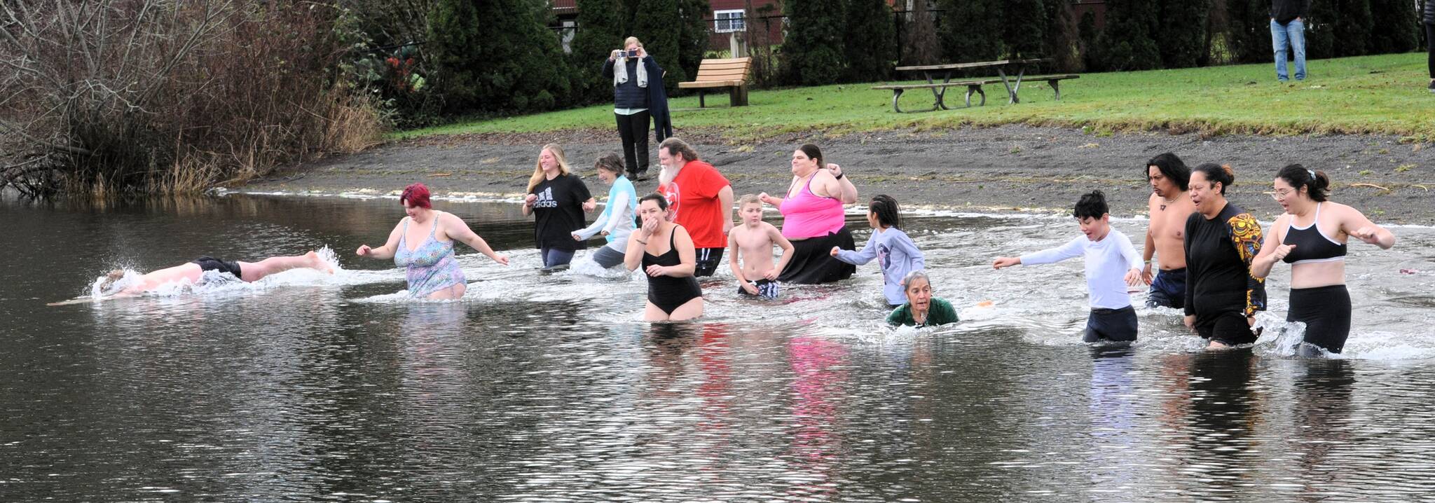 And seventeen take the plunge into the cool waters at the Lake Pleasant County Park on this cool start of the new year. Photo by Lonnie Archibald